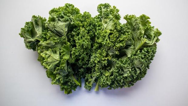 Fresh Kale Leaf isolated on white (excluding the shadow)