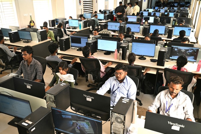 This photograph taken on May 13, 2026 shows engineers annotating data from cameras recording actions through motion capture at AI data company Objectways office in Tamil Nadus Karur district. Developers think feeding first-person footage, called 