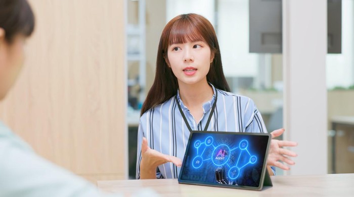 close up of Asian woman presenting futuristic AI Agent Network technology on tablet in modern conference room