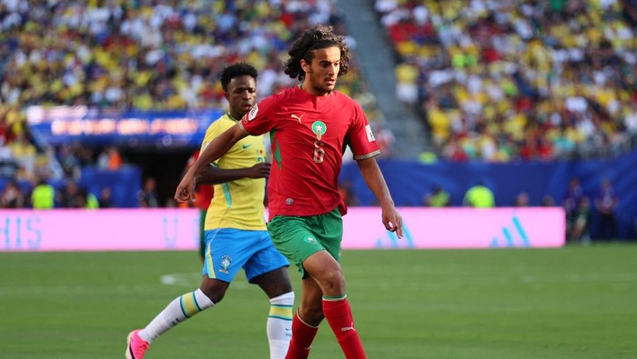 Soccer Football - FIFA World Cup 2026 - Group C - Brazil v Morocco - New York/New Jersey Stadium, East Rutherford, New Jersey, U.S. - June 13, 2026 Moroccos Ayyoub Bouaddi in action with Brazils Vinicius Junior IMAGN IMAGES via Reuters/Caean Couto