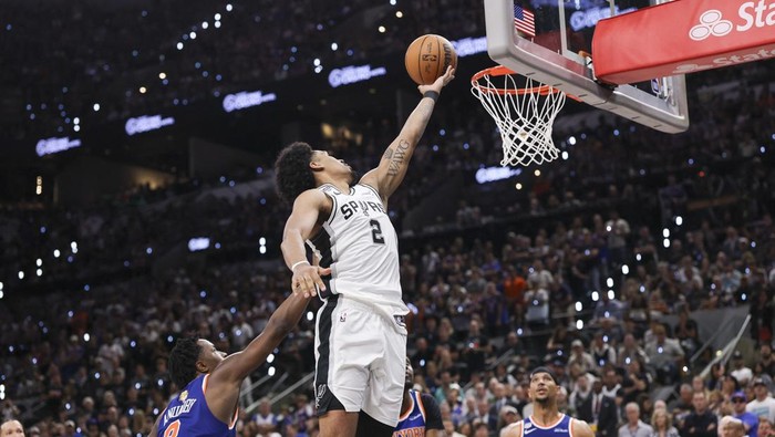 Jun 13, 2026; San Antonio, Texas, USA; San Antonio Spurs guard Dylan Harper (2) drives to the basket past New York Knicks forward Og Anunoby (8) during the third quarter during game five of the 2026 NBA Finals at Frost Bank Center. Mandatory Credit: Geoff Burke-Imagn Images