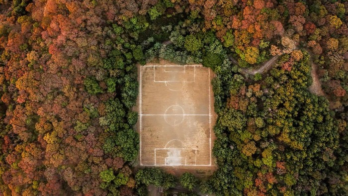 Locals play at the match San Isidro vs Real Bombay for the amateur soccer league games, at the 