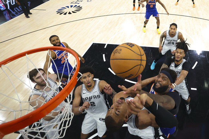 Jun 13, 2026; San Antonio, Texas, USA; The New York Knicks hoist the trophy after defeating the San Antonio Spurs in game five of the 2026 NBA Finals to win the 2026 NBA Championship at Frost Bank Center. Mandatory Credit: Dustin Safranek-Imagn Image