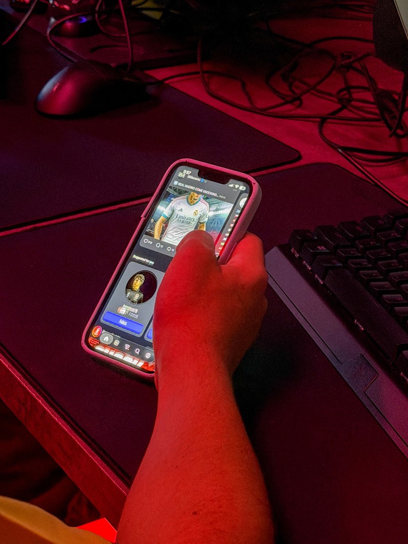 A boy looks at his mobile phone at a gaming centre, after the United Arab Emirates approved a resolution setting the minimum age for social media use at 15, in Dubai, United Arab Emirates, June 18, 2026. Picture taken with a mobile phone. REUTERS/Rula Rouhana