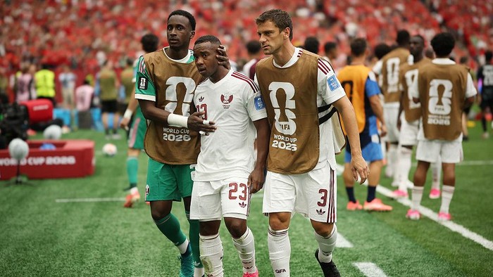 VANCOUVER, BRITISH COLUMBIA - JUNE 18: Assim Madibo #23 of Qatar walks off with his teammates as he receives a red card  during the FIFA World Cup 2026 Group B match between Canada and Qatar at BC Place Vancouver on June 18, 2026 in Vancouver, British Columbia. (Photo by Jared C. Tilton - FIFA/FIFA via Getty Images)