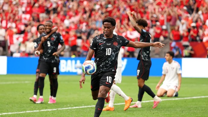 VANCOUVER, BRITISH COLUMBIA - JUNE 18: Jonathan David #10 of Canada celebrates scoring his teams second goal  during the FIFA World Cup 2026 Group B match between Canada and Qatar at BC Place Vancouver on June 18, 2026 in Vancouver, British Columbia. (Photo by Fran Santiago/Getty Images)