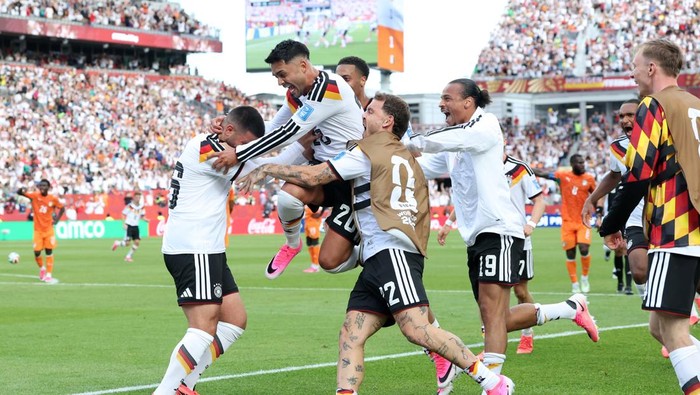 TORONTO, ONTARIO - JUNE 20: Deniz Undav #26 of Germany celebrates with teammates after scoring his teams second goal during the FIFA World Cup 2026 Group E match between Germany and Cote DIvoire at Toronto Stadium on June 20, 2026 in Toronto, Ontario. (Photo by Alexander Hassenstein/Getty Images)