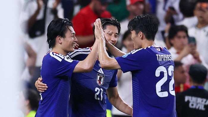 Soccer Football - FIFA World Cup 2026 - Group F - Tunisia v Japan - Estadio Monterrey, Monterrey, Mexico - June 20, 2026 Japans Ayase Ueda celebrates scoring their second goal with Hiroki Ito and Takehiro Tomiyasu REUTERS/Eloisa Sanchez