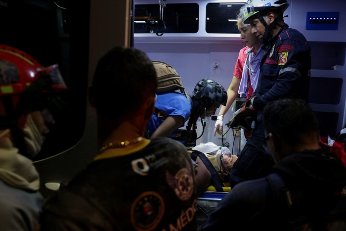 Emergency services work at the site of a collapsed building after an earthquake in Caracas, Venezuela, June 24, 2026. REUTERS/Leonardo Fernandez Viloria