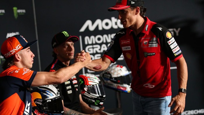 BRNO, CZECH REPUBLIC - JUNE 18: Pedro Acosta of Spain riding a Red Bull KTM shaking hands with Marc Marquez of Spain riding a Lenovo Ducati  at the pre event press conference ahead of the MotoGP of Czechia at Brno Circuit on June 18, 2026 in Brno, Cz