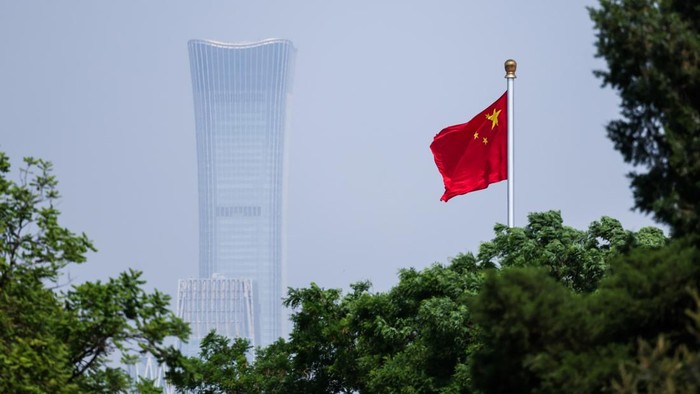 BEIJING, CHINA - MAY 12: China's national flag flutters in the wind next to the CITIC tower ahead of Brunei's Crown Prince Al-Muhtadee Billah and China's President Xi Jinping meeting on May 12, 2026 in Beijing, China. (Photo by Maxim Shemetov Pool/Getty Images)