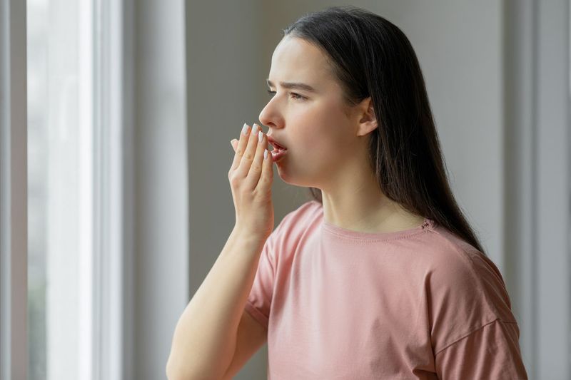 Woman sick and having cough