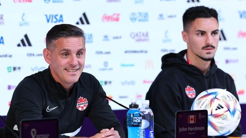 DOHA, QATAR - NOVEMBER 26: John Herdman, Head Coach of Canada, and Stephen Eustaquio of Canada speak during the Canada Press Conference at the Main Media Center on November 26, 2022 in Doha, Qatar. (Photo by Patrick Smith - FIFA/FIFA via Getty Images)