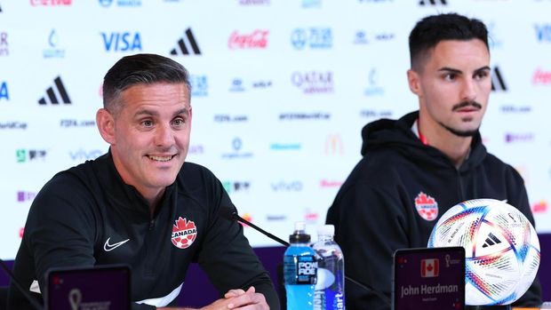 DOHA, QATAR - NOVEMBER 26: John Herdman, Head Coach of Canada, and Stephen Eustaquio of Canada speak during the Canada Press Conference at the Main Media Center on November 26, 2022 in Doha, Qatar. (Photo by Patrick Smith - FIFA/FIFA via Getty Images)