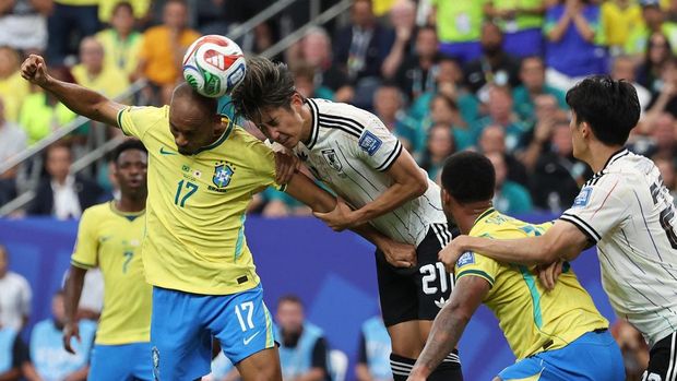 Soccer Football - FIFA World Cup 2026 - Round of 32 - Brazil v Japan - Houston Stadium, Houston, Texas, U.S. - June 29, 2026 Brazil's Fabinho in action with Japan's Hiroki Ito IMAGN IMAGES via Reuters/Troy Taormina