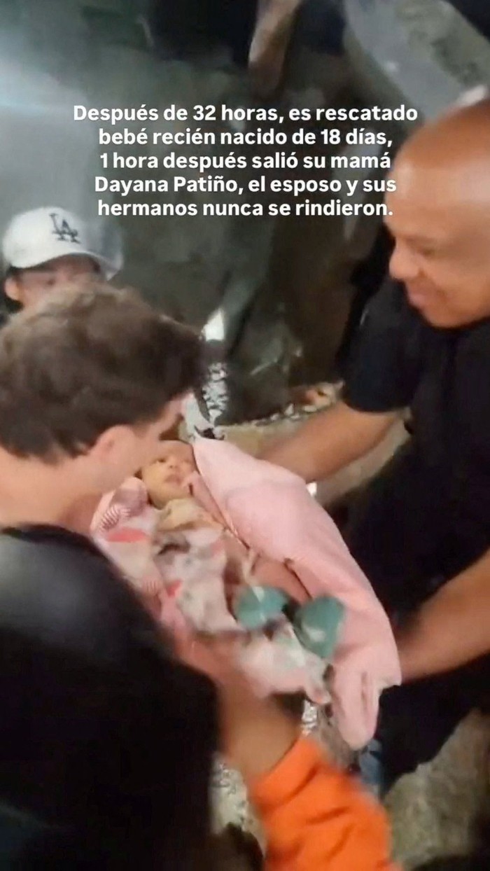 People clean a baby after rescuers pulled the child from the rubble of a collapsed building following deadly earthquakes that struck Venezuela on June 24, in La Guaira, Venezuela, in this screen grab obtained from a social media video released June 26, 2026. Andreina Quintero/via REUTERS  THIS IMAGE HAS BEEN SUPPLIED BY A THIRD PARTY. MANDATORY CREDIT. NO RESALES. NO ARCHIVES. OVERLAY FROM SOURCE.  Verification line: Reuters was not able to verify the location, but multiple sources and media confirmed it as La Guaira, Venezuela. Reuters was not able to verify the date, but no older version of the video was found online before June 26, and the date matches reports of a rescue in the area.