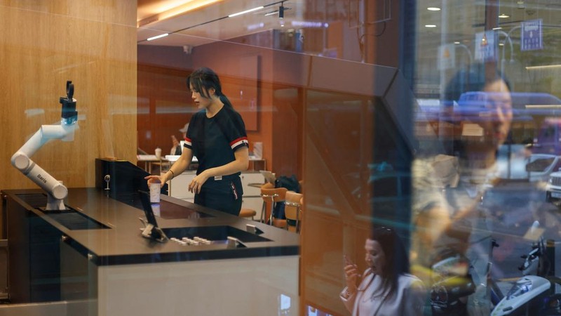 People walk past an unmanned ramen eatery in Seoul, South Korea, June 5, 2026. REUTERS/Kim Soo-hyeon