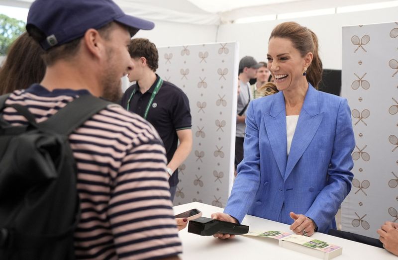 The Princess of Wales speaks to members of the public as they purchase tickets after queueing for entry during a visit on day four of the 2026 Wimbledon Championships at the All England Lawn Tennis and Croquet Club, London. Picture date: Thursday July 2, 2026.    Andrew Matthews/Pool via REUTERS