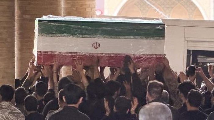 Mourners carry the coffin of Irans slain supreme leader Ali Khamenei at the Grand Mosalla in Tehran on July 3, 2026. Preparations for the funeral of Khamenei were in full swing on July 3, with authorities expecting millions and a coterie of foreign dignitaries to attend the official ceremony. (Photo by Atta KENARE / AFP) /