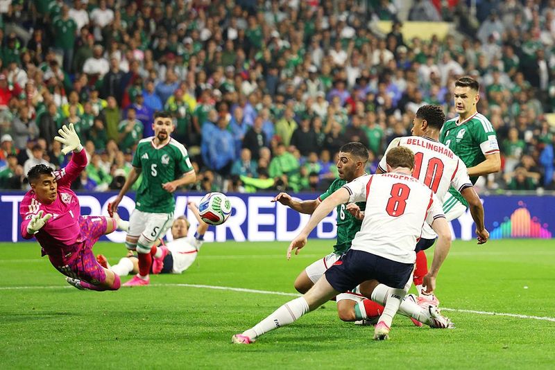 MEXICO CITY, MEXICO - JULY 05: Jude Bellingham #10 of England scores his team's second goal during the FIFA World Cup 2026 Round of 16 match between Mexico and England at Mexico City Stadium on July 05, 2026 in Mexico City, Mexico. (Photo by Michael Steele/Getty Images)
