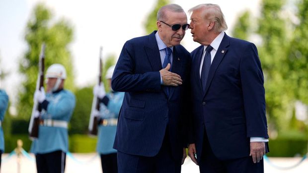 U.S. President Donald Trump speaks with Turkish President Recep Tayyip Erdogan during a formal arrival at the Bestepe Presidential Compound at the NATO summit in Ankara, Turkey, Tuesday, July 7, 2026.     Emrah Gurel/Pool via REUTERS