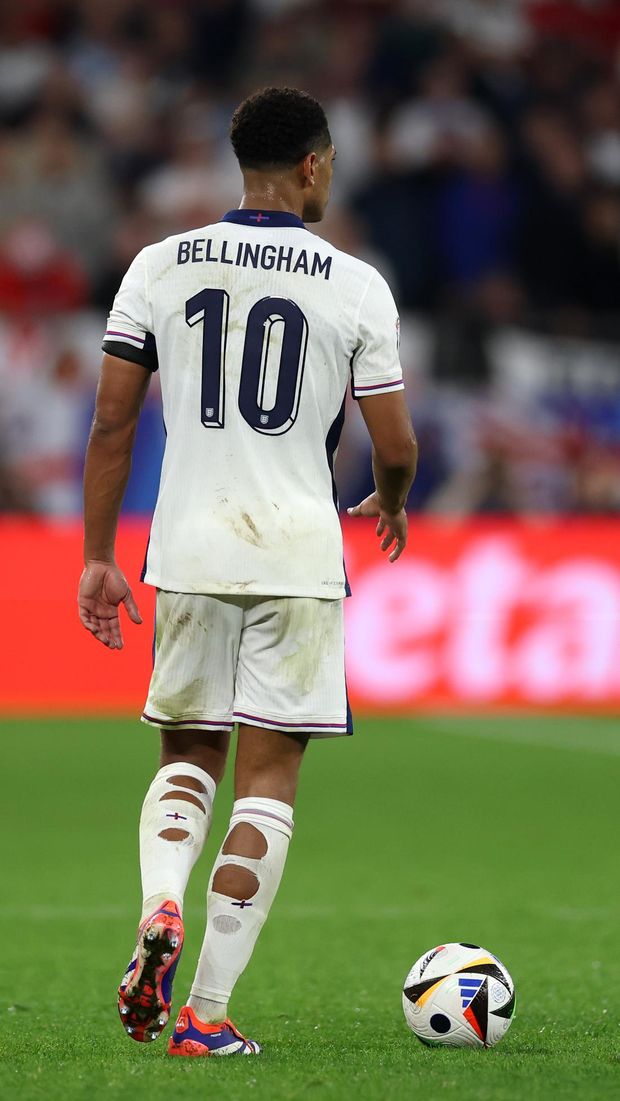 GELSENKIRCHEN, GERMANY - JUNE 16:  A view from behind of Jude Bellingham of England with holes cut out of his socks during the UEFA EURO 2024 group stage match between Serbia and England at Arena AufSchalke on June 16, 2024 in Gelsenkirchen, Germany. (Photo by Lars Baron/Getty Images)