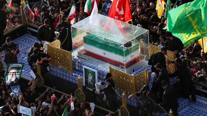 A vehicle carrying the coffin of Iran's late Supreme Leader Ayatollah Ali Khamenei, who was killed on February 28 in Israeli and U.S. airstrikes, makes its way as people attend Khamenei's funeral procession, in Najaf, Iraq, July 8, 2026. REUTERS/Alaa Al-Marjani