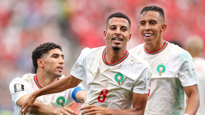 HOUSTON, TEXAS - JULY 04: Azzedine Ounahi #8 of Morocco celebrates with teammates Achraf Hakimi #2 and Soufiane Rahimi #9 after scoring his teams first goal  during the FIFA World Cup 2026 Round of 16 match between Canada and Morocco at Houston Stadium on July 04, 2026 in Houston, Texas. (Photo by Kevin C. Cox/Getty Images)