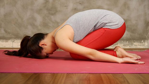 Asian woman do yoga in the gym