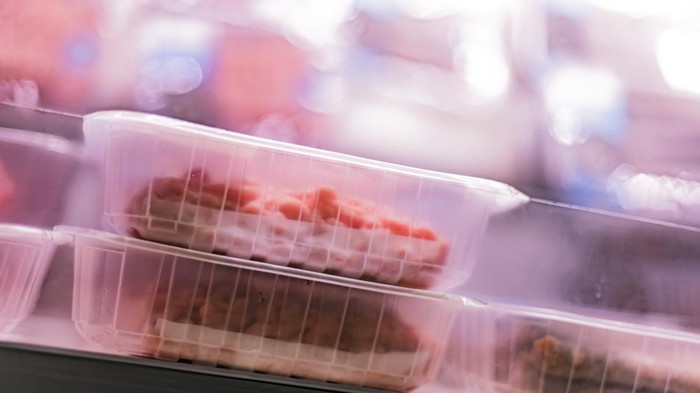 Meat products put up for sale in a supermarket commercial refrigerator