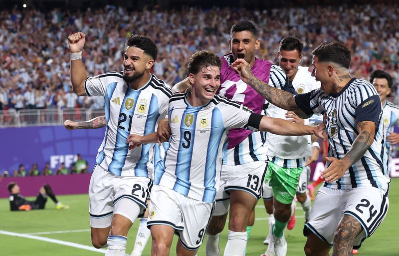 KANSAS CITY, MISSOURI - JULY 11: Julian Alvarez #9 of Argentina celebrates with teammates after scoring his team's second goal during the FIFA World Cup 2026 Quarter Final match between Argentina and Switzerland at Kansas City Stadium on July 11, 2026 in Kansas City, Missouri. (Photo by Carl Recine/Getty Images)