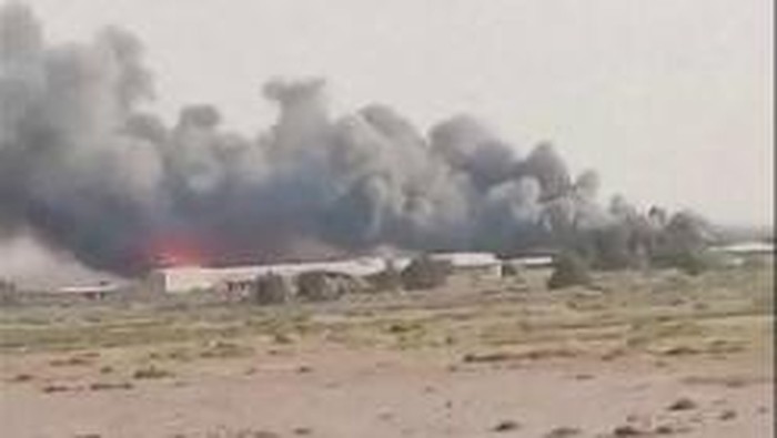 This video grab taken from UGC images posted on social media on July 12, 2026, shows heavy smoke billowing in Abdali, at Kuwaits northern border. Kuwaits defence ministry said on July 12 that three border posts and an offshore oil platform were att