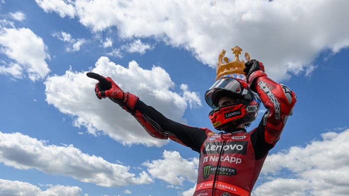 12 July 2026, Saxony, Hohenstein-Ernstthal: Motorsports/Motorcycles: German Grand Prix, Sachsenring, MotoGP, Race: Marc Marquez of Spain, riding for the Ducati Lenovo Team, celebrates his victory with a crown on his head. Photo: Robert Michael/dpa (P