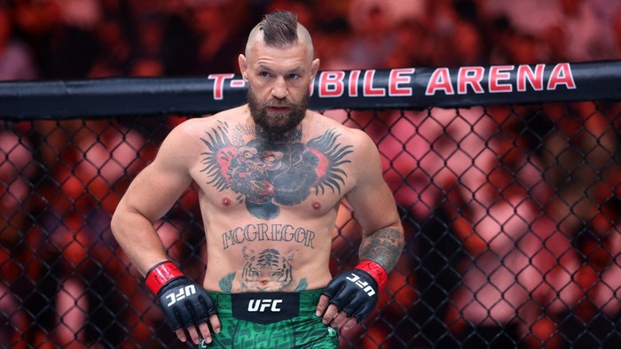 Jul 11, 2026; Las Vegas, Nevada, USA; Conor McGregor (red gloves) looks on in a welterweight bout against Max Holloway (not pictured) during UFC 329 at T-Mobile Arena. Mandatory Credit: Mark J. Rebilas-Imagn Images