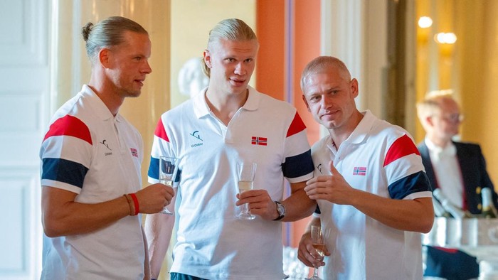 Orjan Haskjold Nyland and Erling Braut Haaland react during a reception by the royal family at the palace for Norway's national football team, in Oslo, Norway, July 13, 2026. Jan Langhaug /NTB/via REUTERS   ATTENTION EDITORS - THIS IMAGE WAS PROVIDED BY A THIRD PARTY. NORWAY OUT. NO COMMERCIAL OR EDITORIAL SALES IN NORWAY.   REFILE TO REMOVE RESTRICTION