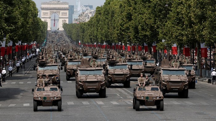 Vehicles of the French 9th Marine Infantry Brigade drive down the Champs-Elysees avenue during the annual Bastille Day military parade in Paris, France, July 14, 2026. REUTERS/Benoit Tessier