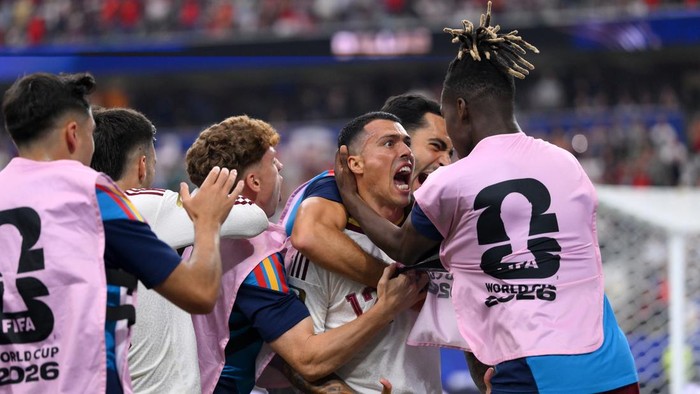 ARLINGTON, TEXAS - JULY 14: Pedro Porro #12 of Spain celebrates with teammates after scoring the teams second goal during the FIFA World Cup 2026 Semi Final match between France and Spain at Dallas Stadium on July 14, 2026 in Arlington, Texas. (Photo by David Ramos/Getty Images)