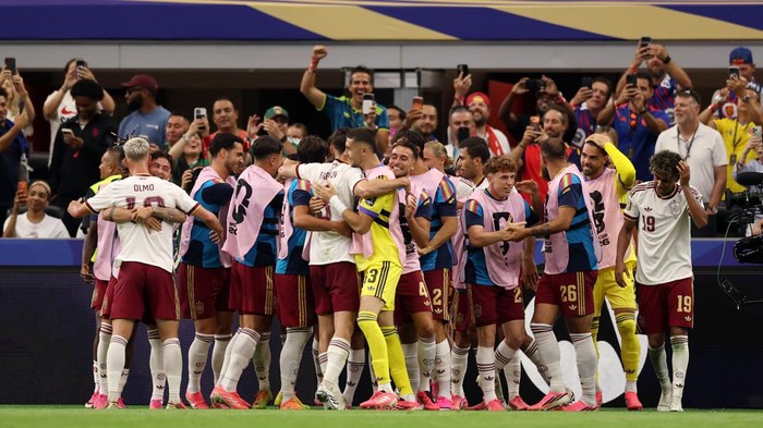 ARLINGTON, TEXAS - JULY 14: Pedro Porro #12 of Spain celebrates scoring his teams second goal with teammates during the FIFA World Cup 2026 Semi Final match between France and Spain at Dallas Stadium on July 14, 2026 in Arlington, Texas. (Photo by Tullio Puglia - FIFA/FIFA via Getty Images)
