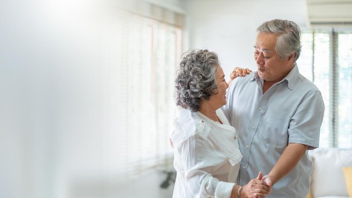 Asian Senior adult couple Celebrating Wedding Anniversary with dancing. Romance, lover.