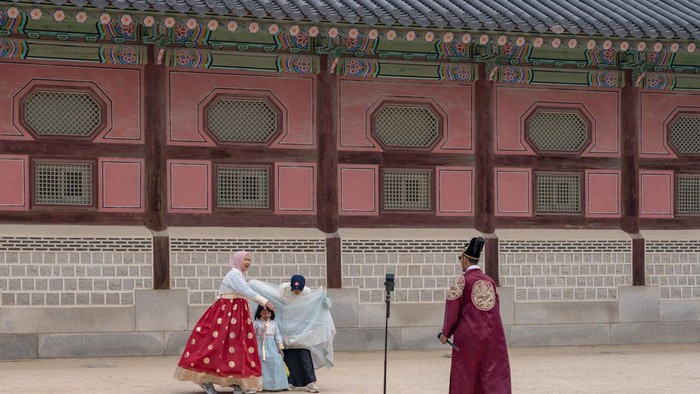 A man takes a photo in Gyeongbokgung Palace in Seoul, South Korea, on May 2, 2026. Gyeongbokgung Palace is the primary palace of the Joseon dynasty, established in 1395 after the foundation of the dynasty in 1392. (Photo by Kichul Shin/NurPhoto via Getty Images)