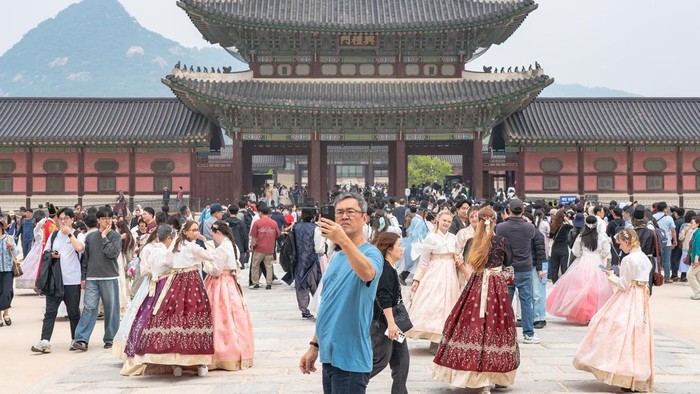 A man takes a photo in Gyeongbokgung Palace in Seoul, South Korea, on May 2, 2026. Gyeongbokgung Palace is the primary palace of the Joseon dynasty, established in 1395 after the foundation of the dynasty in 1392. (Photo by Kichul Shin/NurPhoto via Getty Images)