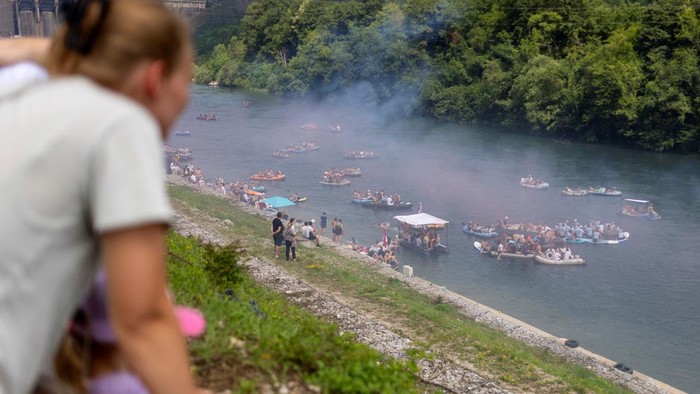 Drone view of people riding rafts and inflatable boats during the annual Drina Regatta on the Drina River near Bajina Basta, Serbia, July 18, 2026. The event, held for more than 30 years, attracts thousands of participants each year. REUTERS/Djordje Kojadinovic