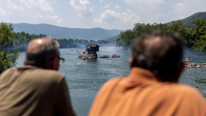 Drone view of people riding rafts and inflatable boats during the annual Drina Regatta on the Drina River near Bajina Basta, Serbia, July 18, 2026. The event, held for more than 30 years, attracts thousands of participants each year. REUTERS/Djordje Kojadinovic