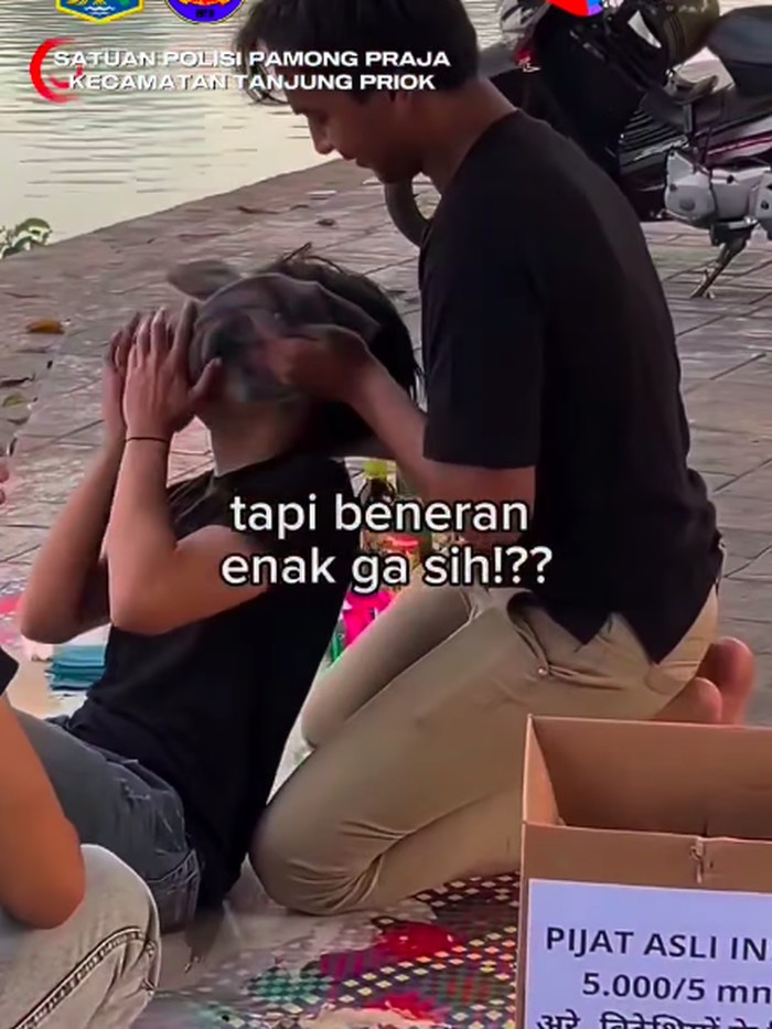 Satpol PP memastikan video viral praktik pijat ala India disertai penyajian miras di Danau Sunter hanya konten medsos. Kreator diimbau bijaksana. (dok Satpol PP JU)
