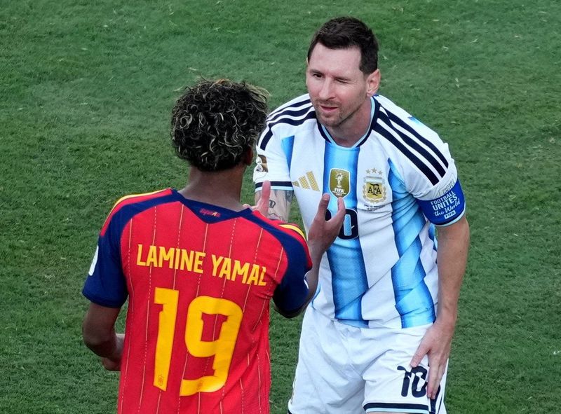 Soccer Football - FIFA World Cup 2026 - Final - Spain v Argentina - New York/New Jersey Stadium, East Rutherford, New Jersey, U.S. - July 19, 2026 Spain's Lamine Yamal shakes hands with Argentina's Lionel Messi as he celebrates winning the World Cup IMAGN IMAGES via Reuters/James Lang     TPX IMAGES OF THE DAY