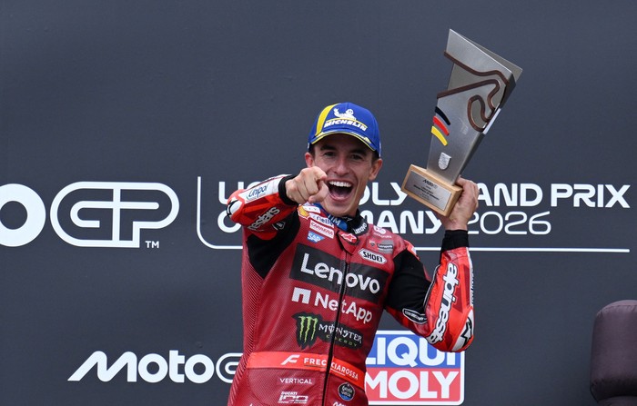 MotoGP - German Grand Prix - Sachsenring, Hohenstein-Ernstthal, Germany - July 12, 2026 Ducati Lenovo Teams Marc Marquez celebrates on the podium after winning the MotoGP race REUTERS/Annegret Hilse