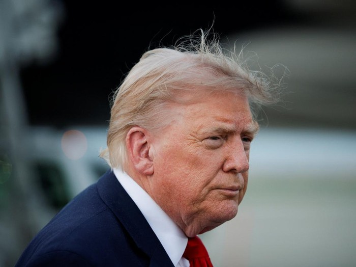U.S. President Donald Trump speaks with the media as he arrives at Joint Base Andrews in Maryland, U.S., July 19, 2026. REUTERS/Evan Vucci