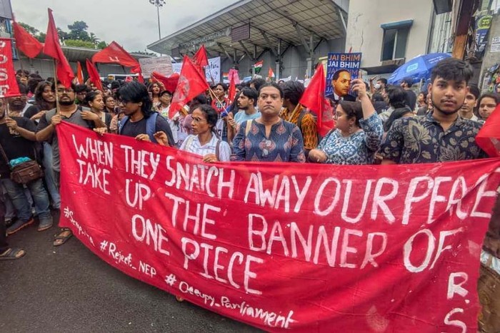 A supporter of the Cockroach Janta Party (CJP) holds a Straw Hat Pirates' Jolly Roger poster from the series One Piece after Sonam Wangchuk was moved by authorities to a hospital during his hunger strike, during a protest demanding the resignation of Indian Education Minister Dharmendra Pradhan, in Mumbai, India, July 19, 2026. REUTERS/Francis Mascarenhas