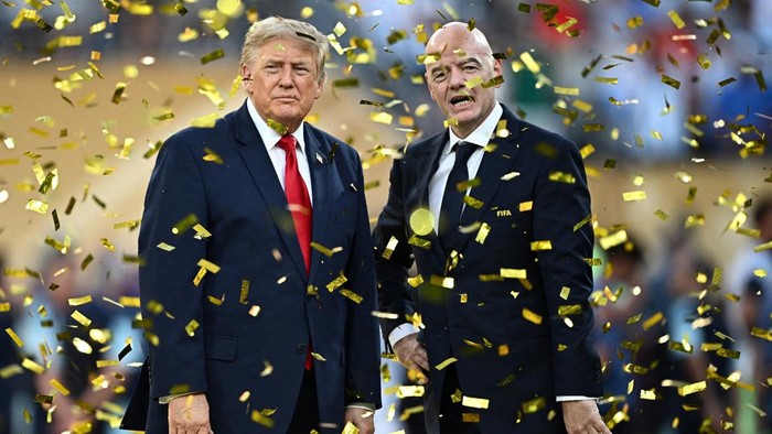 Soccer Football - FIFA World Cup 2026 - Final - Spain v Argentina - New York/New Jersey Stadium, East Rutherford, New Jersey, U.S. - July 19, 2026 U.S. President Donald Trump and FIFA President Gianni Infantino during the trophy presentation after th
