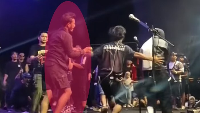 Pria (lingkaran merah) yang Memeluk Tantri vokalis Kotak saat di panggung.
